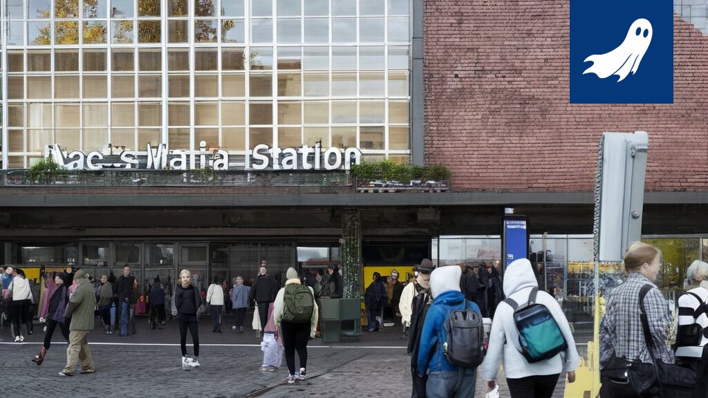 Sarjakuvamainen kuva Tampereen rautatieasemalta, jossa koirat ohjaavat matkustajia ja valvovat Prismasta tulevaa liikennettä.